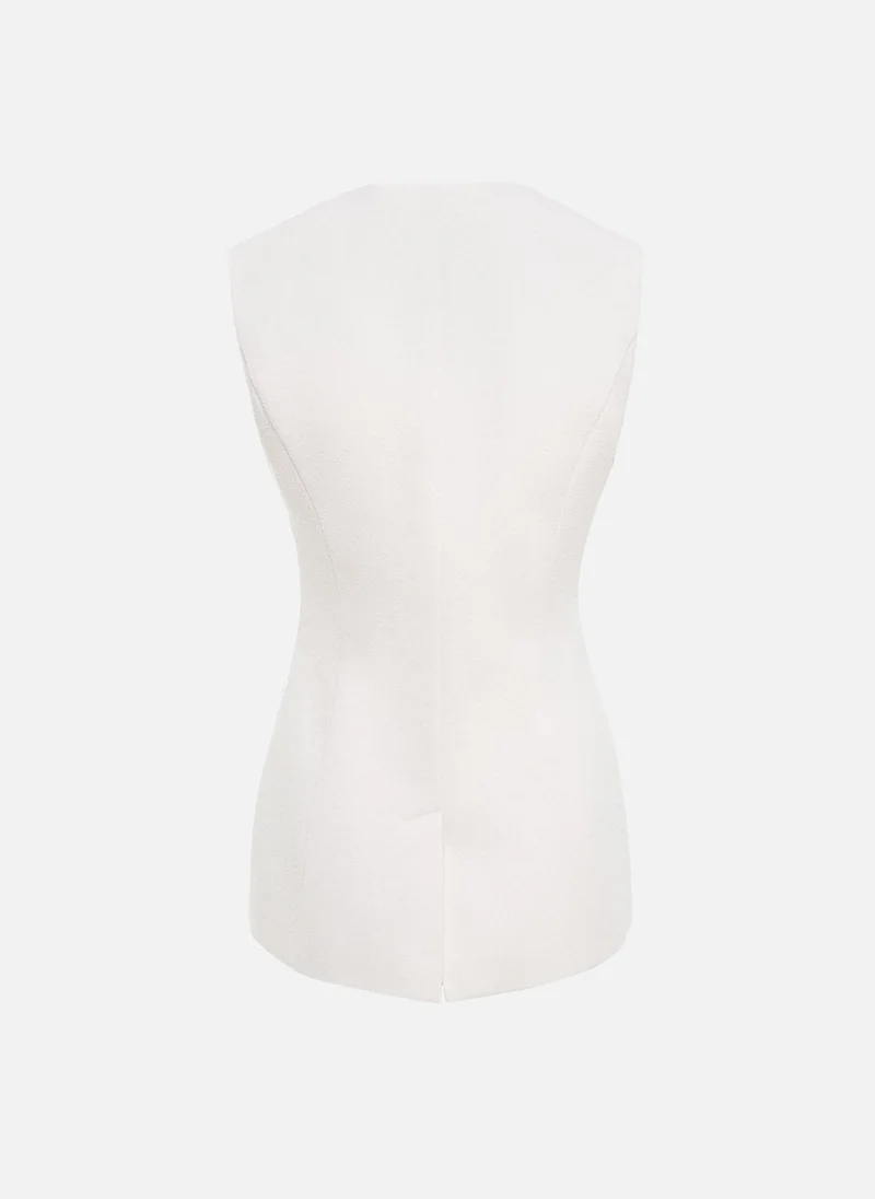 ليتشي صدرية مزودة بأزرار مميزة